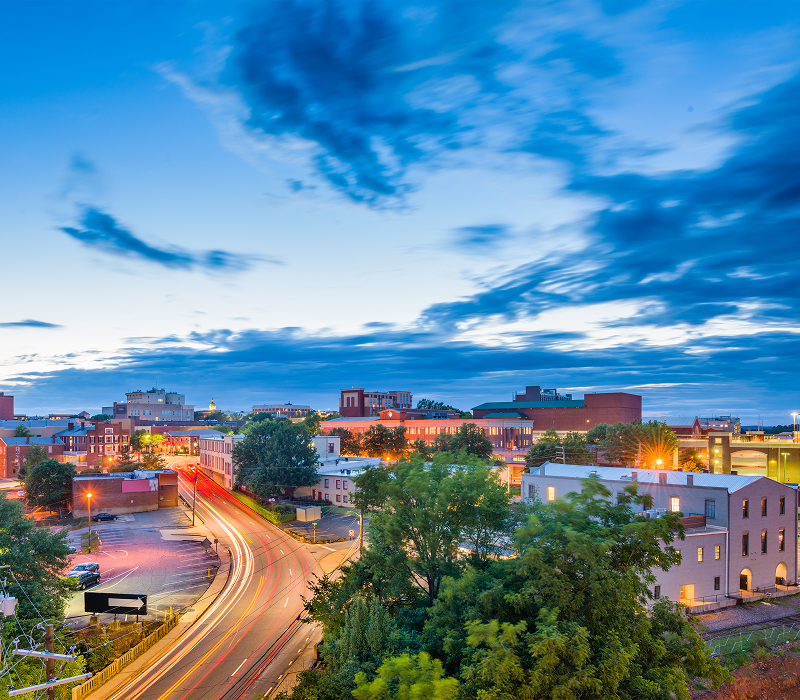 View of Athens, GA with clouds, buildings, and traffic on roadways