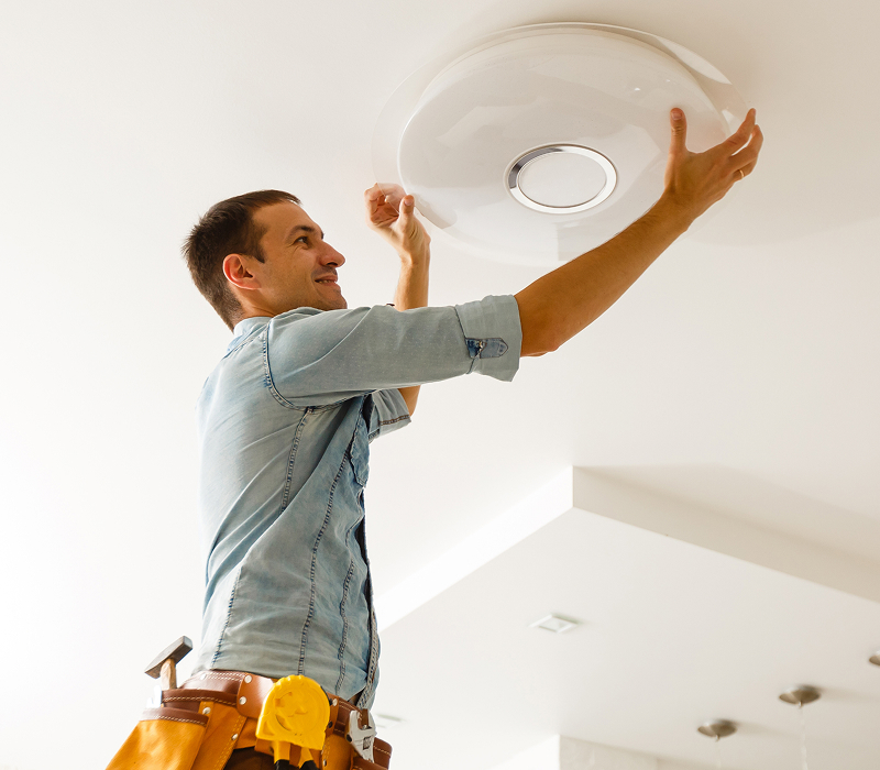 Residential Trusted Electrician Technician working on Celing Light fixture
